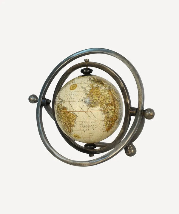 Small rotating globe in antique silver metal finish with natural map